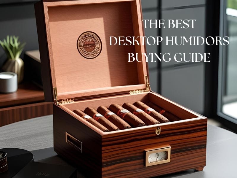 A desktop humidor filled with cigars placed on a desk.
