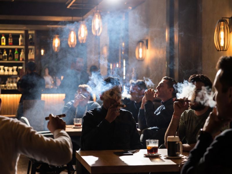 People smoking in a cigar lounge