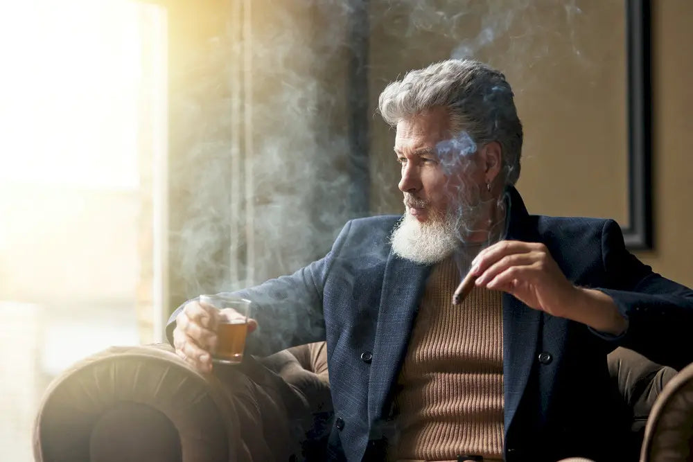 Stylish man smoking a cigar