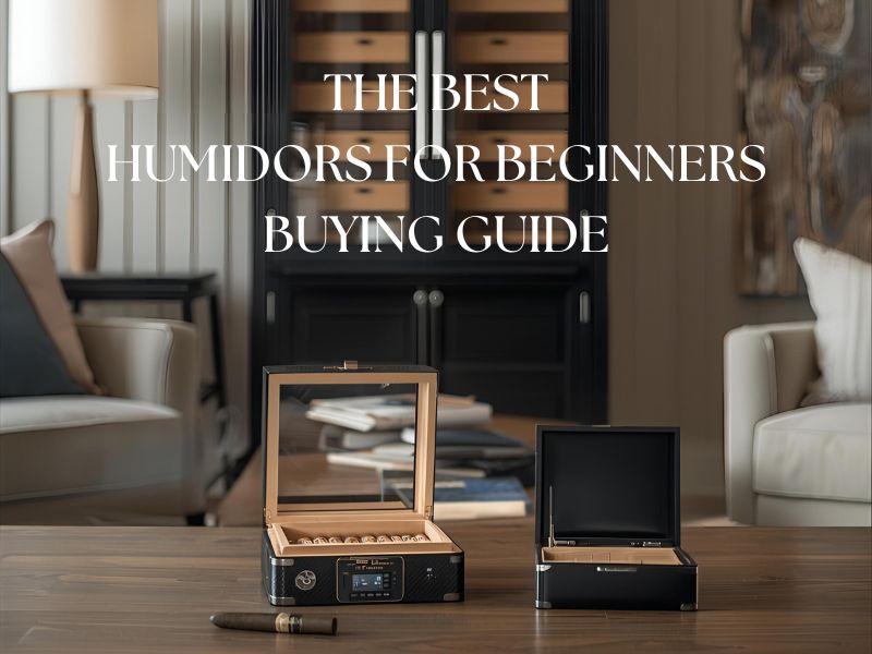 A desktop humidor next to a travel humidor, in the background, a cabinet humidor