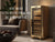 A golden electric cigar humidor cabinet in a modern living room