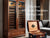 A large cigar cabinet humidor standing next to a Small desktop humidor