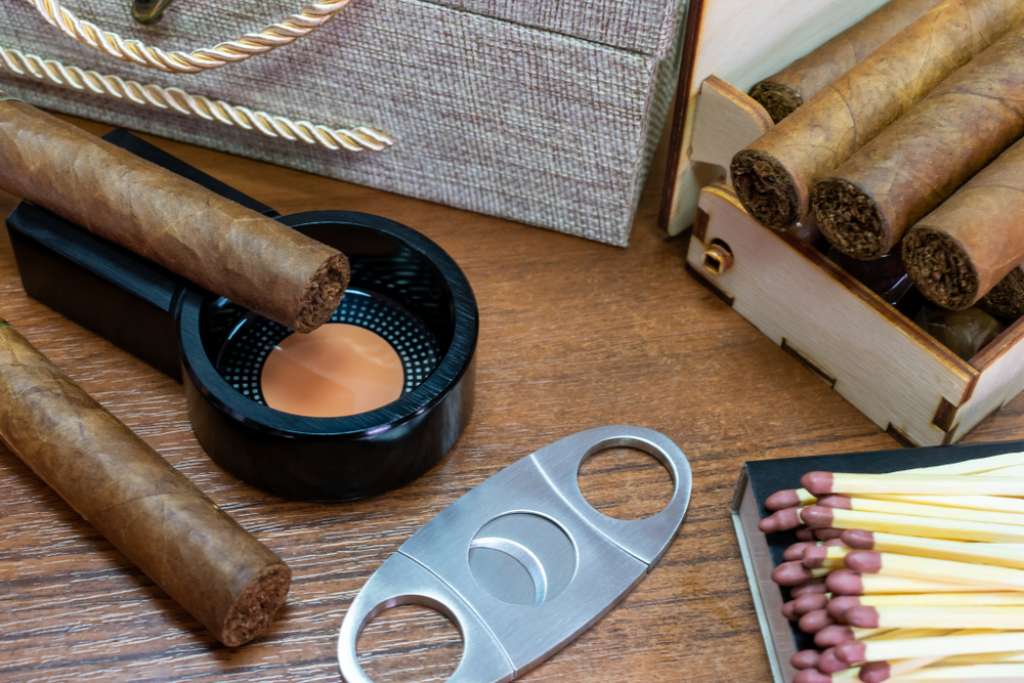 Cigar accessories on a wooden table