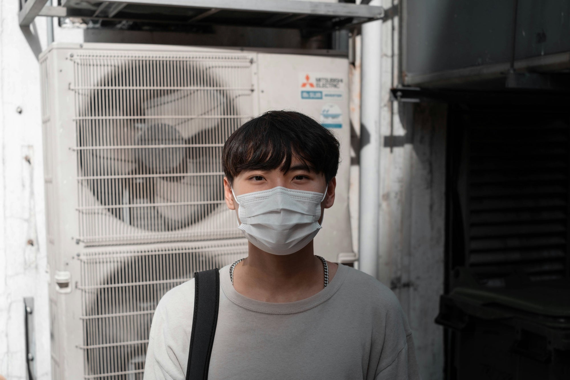 a man wearing a mask to avoid inhaling voc