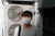 a man wearing a mask to avoid inhaling voc