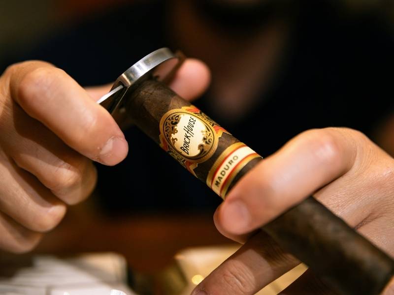 removing the cap using a cigar cutter